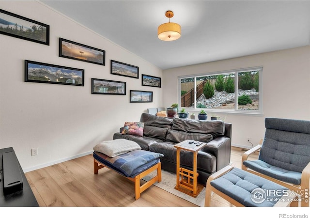 2940 E Yarrow Cir, Superior, CO 80027 - living area featuring vaulted ceiling, light wood-type flooring, and baseboards