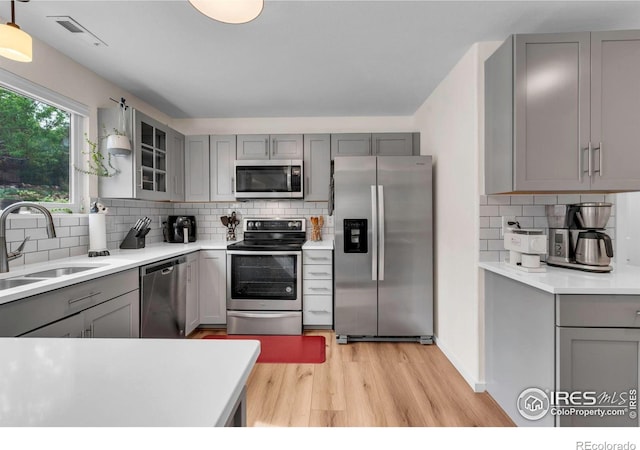 2940 E Yarrow Cir, Superior, CO 80027 - kitchen with appliances with stainless steel finishes and gray cabinetry
