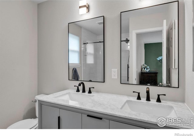 2940 E Yarrow Cir, Superior, CO 80027 - bathroom featuring toilet, an enclosed shower, and double vanity