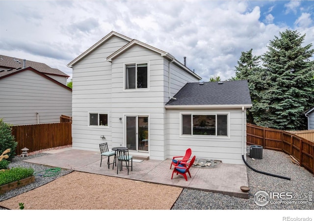 2940 E Yarrow Cir, Superior, CO 80027 - rear view of property with a patio area, a fenced backyard, and roof with shingles
