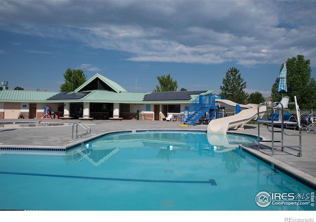 2940 E Yarrow Cir, Superior, CO 80027 - community pool featuring a patio area and a water slide