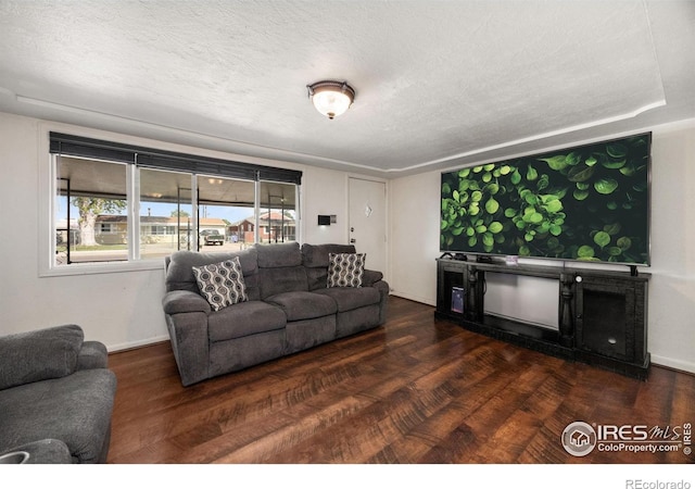 405 16th Ave, Greeley, CO 80631 - living area with a textured ceiling and wood finished floors