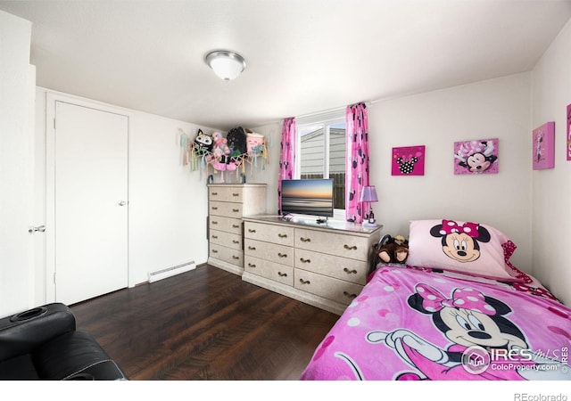 405 16th Ave, Greeley, CO 80631 - bedroom featuring baseboard heating and dark wood-type flooring