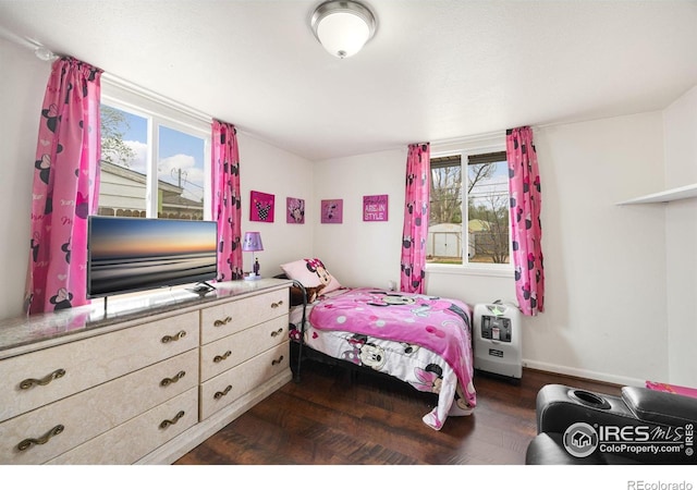 405 16th Ave, Greeley, CO 80631 - bedroom featuring dark wood finished floors and baseboards