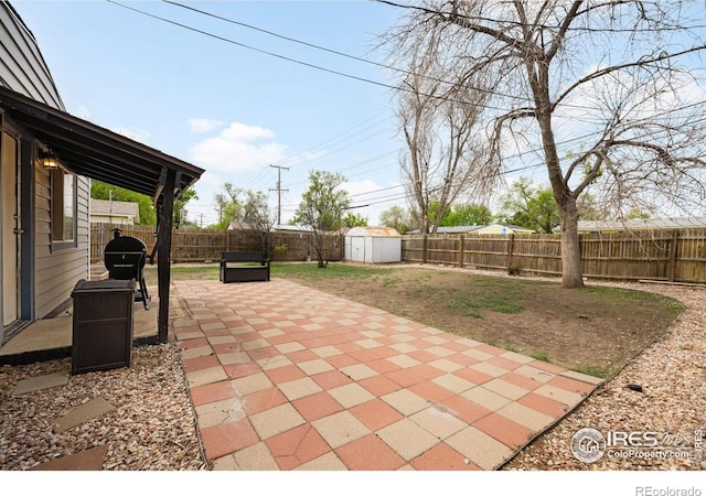 405 16th Ave, Greeley, CO 80631 - fenced backyard featuring a patio area and area for grilling
