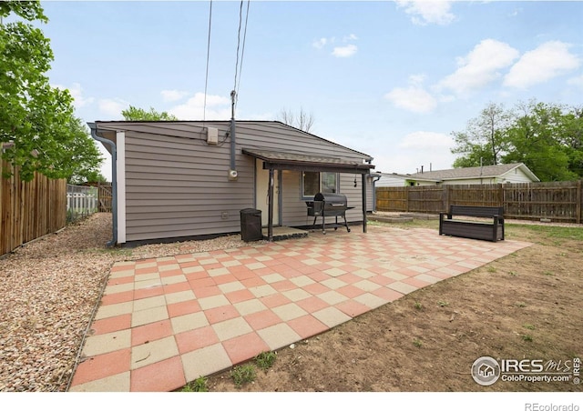 405 16th Ave, Greeley, CO 80631 - rear view of property with a patio area and a fenced backyard