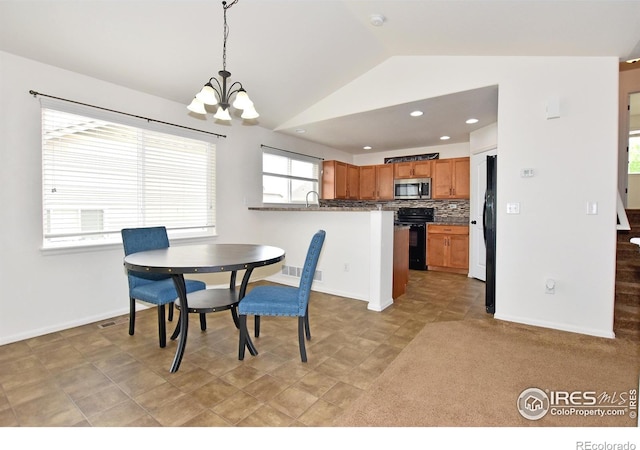 2334 75th Ave, Greeley, CO 80634 - dining space featuring a chandelier, lofted ceiling, baseboards, and recessed lighting
