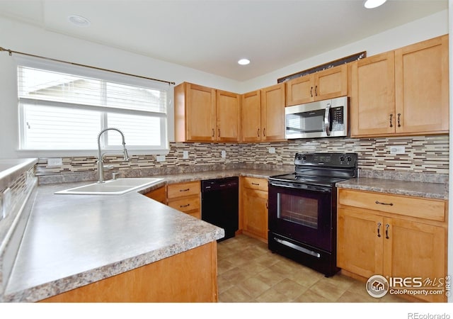 2334 75th Ave, Greeley, CO 80634 - kitchen featuring black appliances, a sink, decorative backsplash, and light brown cabinetry