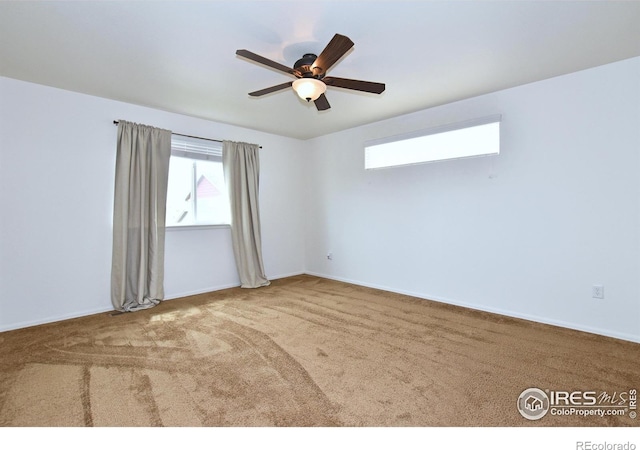 2334 75th Ave, Greeley, CO 80634 - spare room featuring carpet, a ceiling fan, and baseboards