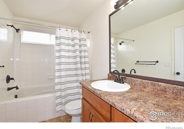 2334 75th Ave, Greeley, CO 80634 - bathroom featuring tiled shower / bath combo, toilet, vanity, and tile patterned flooring