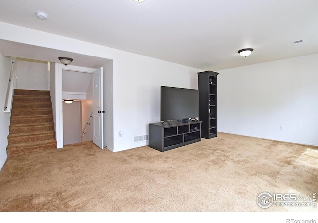 2334 75th Ave, Greeley, CO 80634 - unfurnished living room featuring carpet floors, stairway, and baseboards