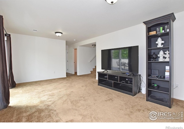 2334 75th Ave, Greeley, CO 80634 - carpeted living area with stairs and baseboards