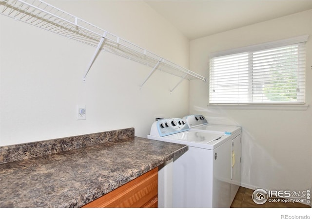 2334 75th Ave, Greeley, CO 80634 - laundry room featuring washer and clothes dryer, baseboards, and tile patterned floors