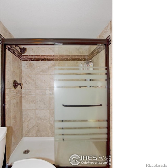 2334 75th Ave, Greeley, CO 80634 - full bath with toilet, a shower stall, and radiator heating unit