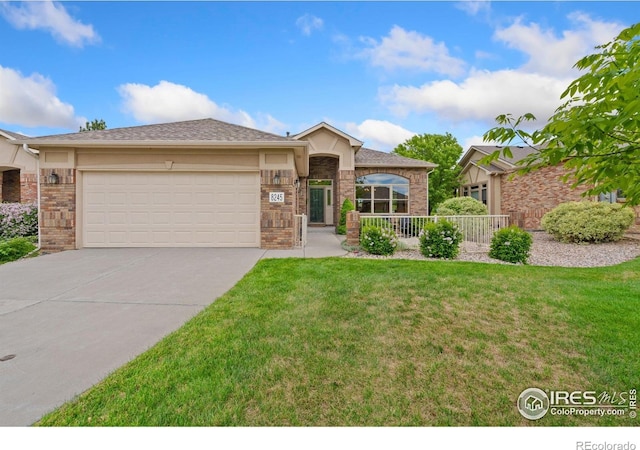 8245 Hidden Cove Ct, Windsor, CO 80528 - ranch-style house featuring driveway, an attached garage, a front yard, and brick siding