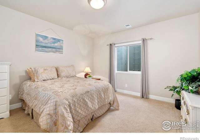 8245 Hidden Cove Ct, Windsor, CO 80528 - bedroom with light colored carpet and baseboards