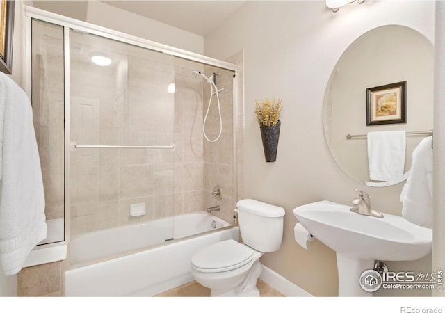 8245 Hidden Cove Ct, Windsor, CO 80528 - full bath with toilet, baseboards, and shower / bath combination with glass door
