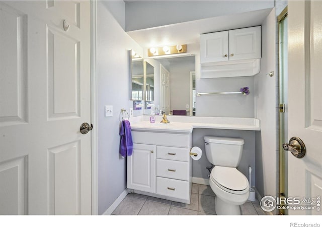 4475 Laguna Pl Unit 201, Boulder, CO 80303 - bathroom with tile patterned flooring, toilet, vanity, and baseboards