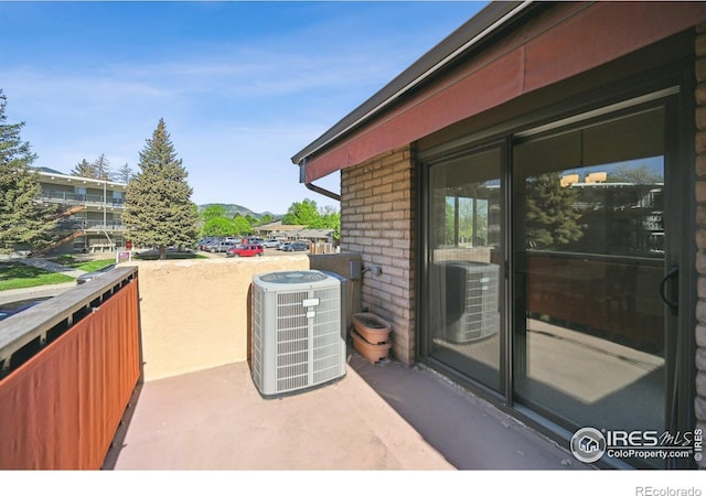 4475 Laguna Pl Unit 201, Boulder, CO 80303 - view of patio / terrace with central AC and a balcony