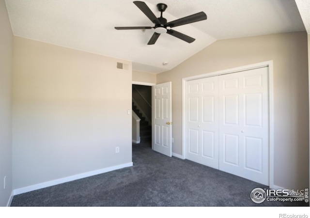 2162 Concord Ln, Superior, CO 80027 - unfurnished bedroom featuring dark colored carpet, lofted ceiling, a closet, baseboards, and ceiling fan