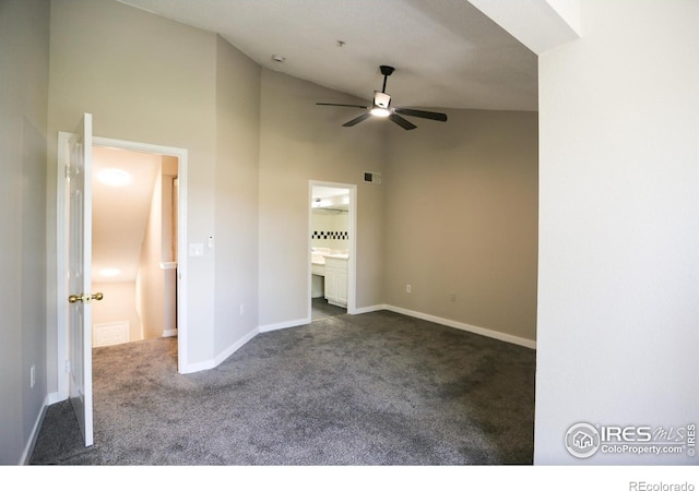 2162 Concord Ln, Superior, CO 80027 - unfurnished bedroom with dark carpet, high vaulted ceiling, baseboards, and ensuite bath