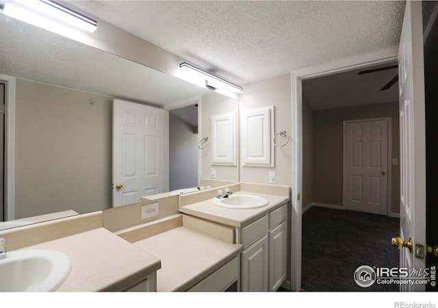 2162 Concord Ln, Superior, CO 80027 - bathroom with a textured ceiling and vanity