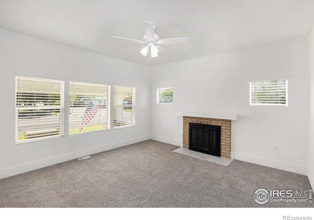 501 Adams Ave, Akron, CO 80720 - unfurnished living room with carpet flooring, baseboards, a fireplace, and a ceiling fan