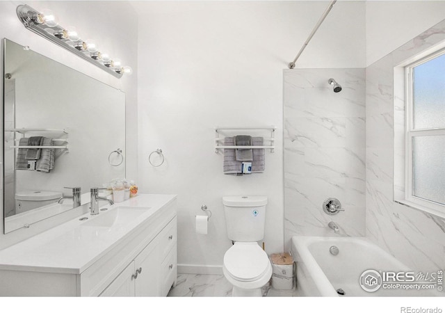 501 Adams Ave, Akron, CO 80720 - bathroom featuring marble finish flooring, toilet, vanity,  shower combination, and baseboards