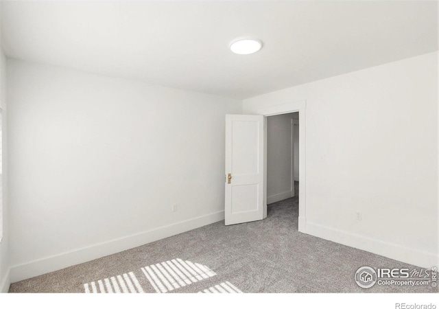 501 Adams Ave, Akron, CO 80720 - carpeted empty room with baseboards