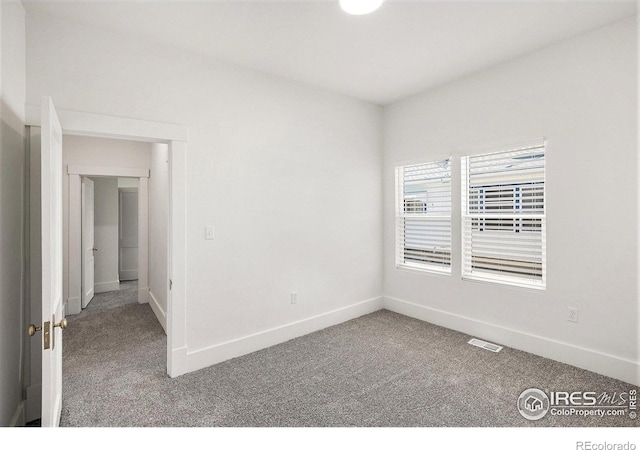 501 Adams Ave, Akron, CO 80720 - carpeted spare room featuring baseboards