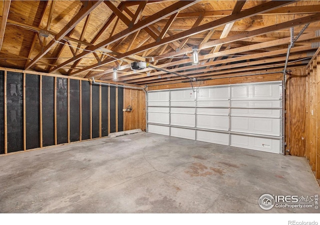 501 Adams Ave, Akron, CO 80720 - garage featuring a garage door opener