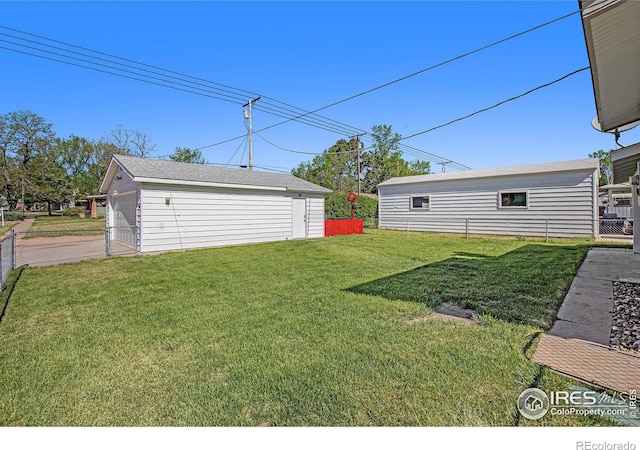 501 Adams Ave, Akron, CO 80720 - view of yard with an outdoor structure and a garage