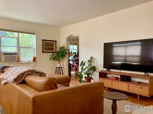 3201 Broadway St, Boulder, CO 80304 - living room featuring arched walkways, wood finished floors, and cooling unit
