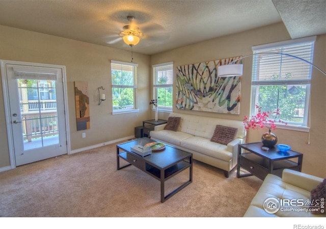 705 Rawlins Way, Lafayette, CO 80026 - living room with a ceiling fan, light colored carpet, baseboards, and a textured ceiling
