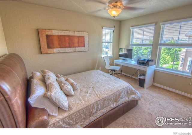 705 Rawlins Way, Lafayette, CO 80026 - carpeted bedroom with baseboards and a ceiling fan