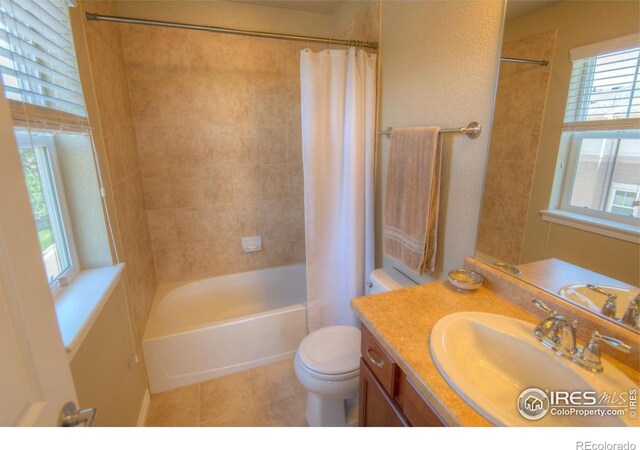 705 Rawlins Way, Lafayette, CO 80026 - full bathroom with tile patterned flooring, vanity, shower / tub combo with curtain, and healthy amount of natural light