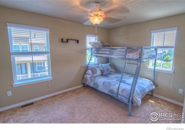 705 Rawlins Way, Lafayette, CO 80026 - bedroom with carpet, baseboards, and a ceiling fan