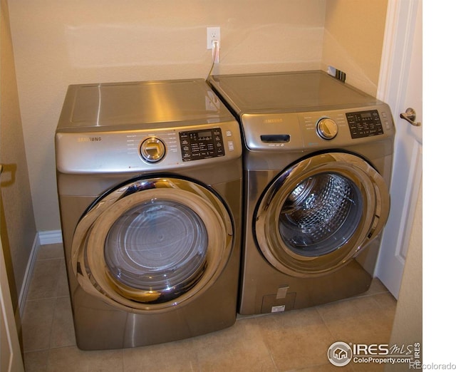 705 Rawlins Way, Lafayette, CO 80026 - laundry room with washer and dryer and tile patterned floors