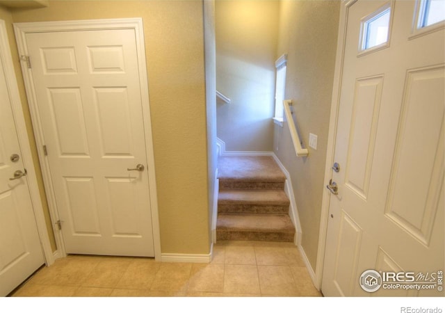705 Rawlins Way, Lafayette, CO 80026 - stairway featuring baseboards and tile patterned flooring