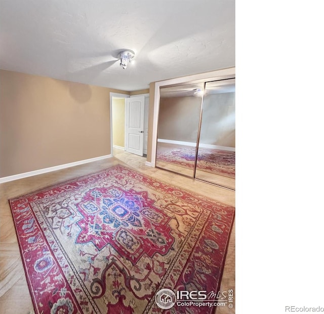8200 S Locust Way, Centennial, CO 80112 - unfurnished bedroom featuring baseboards and a closet