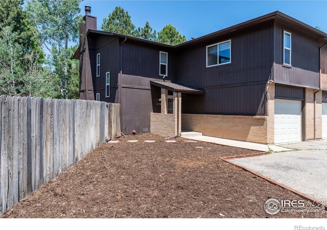 1215 Centaur Cir Unit A, Lafayette, CO 80026 - view of front of house featuring brick siding and a chimney