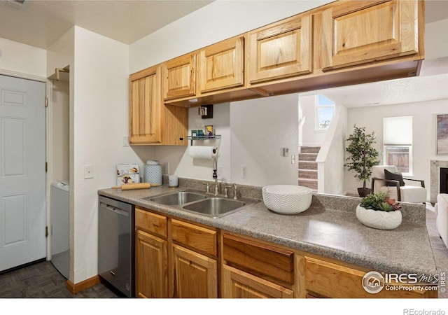 1215 Centaur Cir Unit A, Lafayette, CO 80026 - kitchen with dishwashing machine, a sink, open floor plan, and a fireplace