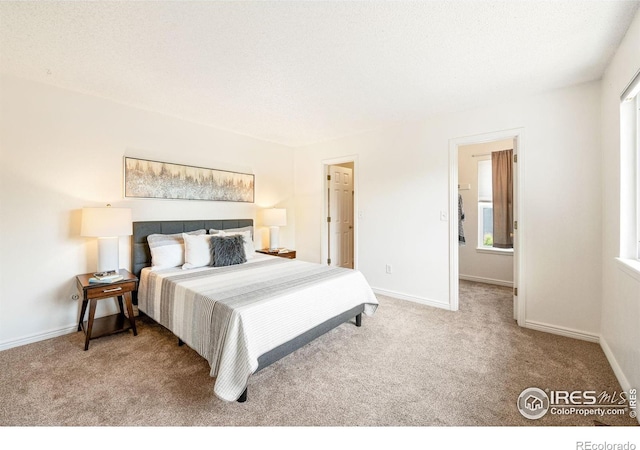1215 Centaur Cir Unit A, Lafayette, CO 80026 - carpeted bedroom with baseboards and multiple windows