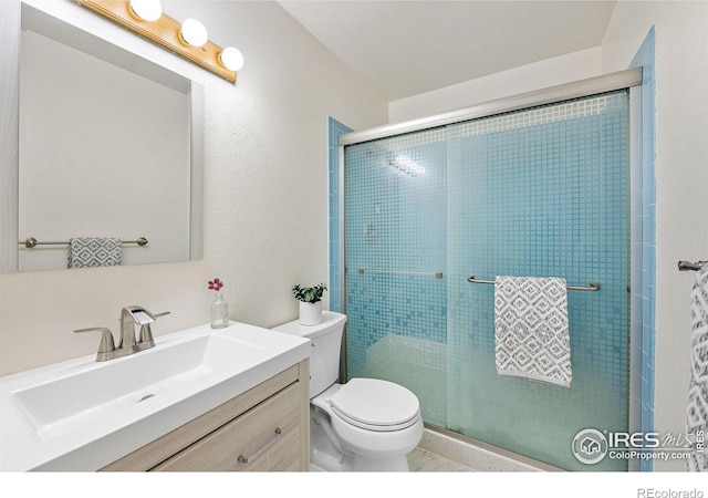 1215 Centaur Cir Unit A, Lafayette, CO 80026 - bathroom with toilet, vanity, and a shower stall