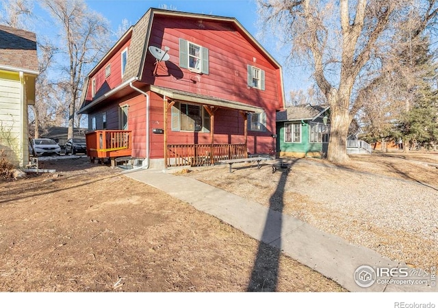 810 W Laurel St, Fort Collins, CO 80521 - chalet / cabin with covered porch and a gambrel roof