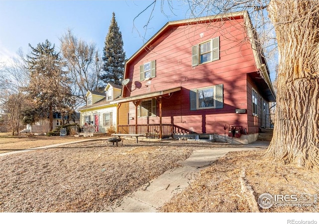 810 W Laurel St, Fort Collins, CO 80521 - rustic home with an outdoor fire pit and a gambrel roof