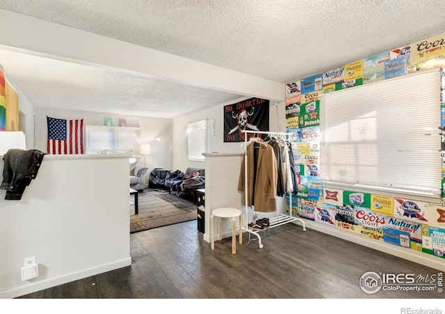 810 W Laurel St, Fort Collins, CO 80521 - game room featuring a textured ceiling, wood finished floors, and baseboards