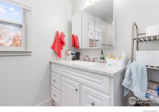 810 W Laurel St, Fort Collins, CO 80521 - bathroom with vanity and baseboards