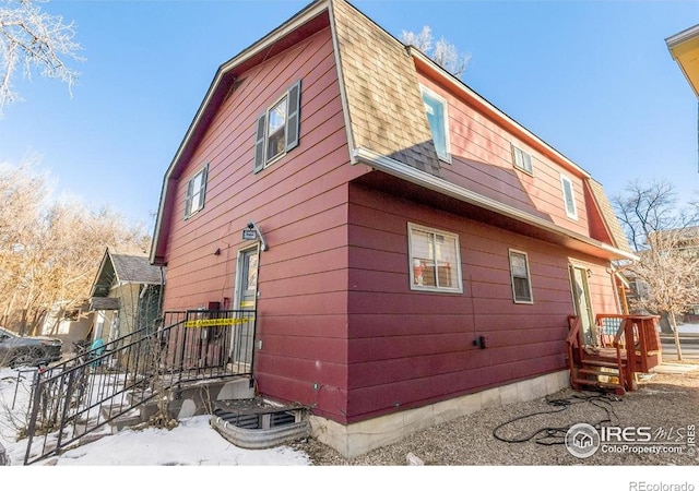 810 W Laurel St, Fort Collins, CO 80521 - view of side of property with a gambrel roof and roof with shingles