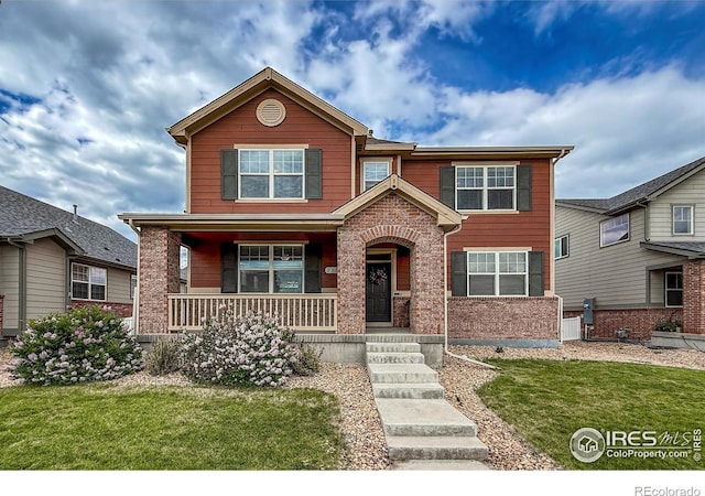 2190 Winding Dr, Longmont, CO 80504 - view of front of property with covered porch and a front lawn